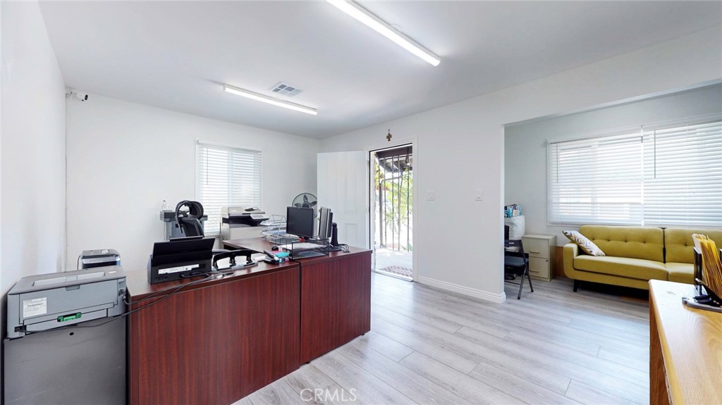 6851 Foothill Boulevard Tujunga, CA 91042 - Photo 14 of 50 a living room with furniture and a wooden floor