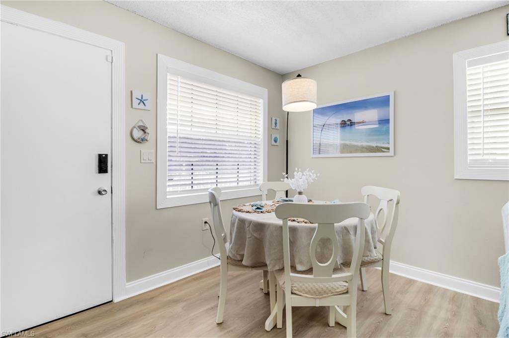 3325 Airport Road North, Unit G5 Naples, FL 34105 - Photo 2 of 8 Dining space with light wood finished floors and baseboards