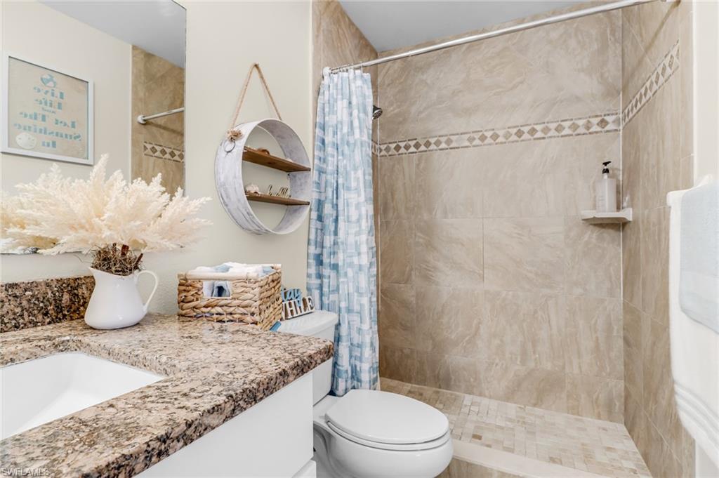 3325 Airport Road North, Unit G5 Naples, FL 34105 - Photo 7 of 8 Full bath with vanity and a shower stall