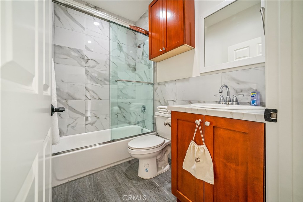 1101 North Maclay Avenue, Unit 1 San Fernando, CA 91340 - Photo 14 of 41 a bathroom with a sink a toilet and shower