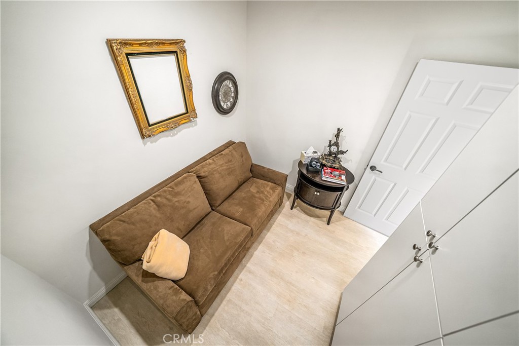 1101 North Maclay Avenue, Unit 1 San Fernando, CA 91340 - Photo 15 of 41 a living room with couch and wall paintings