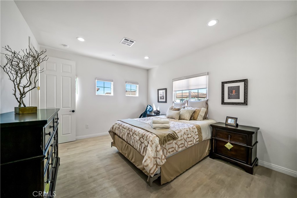 1101 North Maclay Avenue, Unit 1 San Fernando, CA 91340 - Photo 21 of 41 a bedroom with a bed and a table