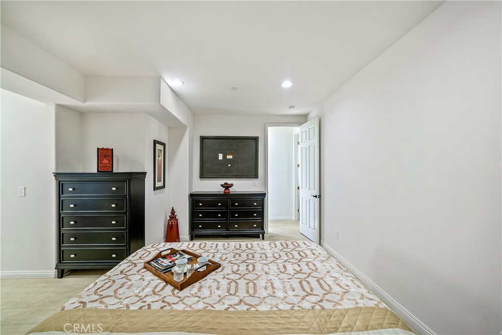 1101 North Maclay Avenue, Unit 1 San Fernando, CA 91340 - Photo 24 of 41 a bedroom with a bed and dresser