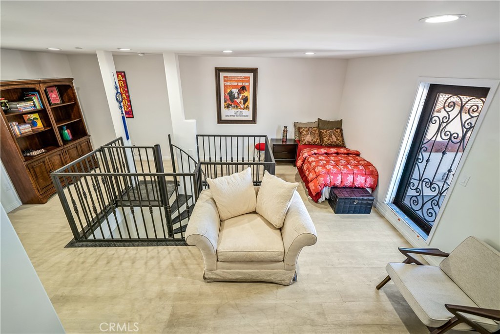 1101 North Maclay Avenue, Unit 1 San Fernando, CA 91340 - Photo 28 of 41 a bedroom with furniture and a wooden floor