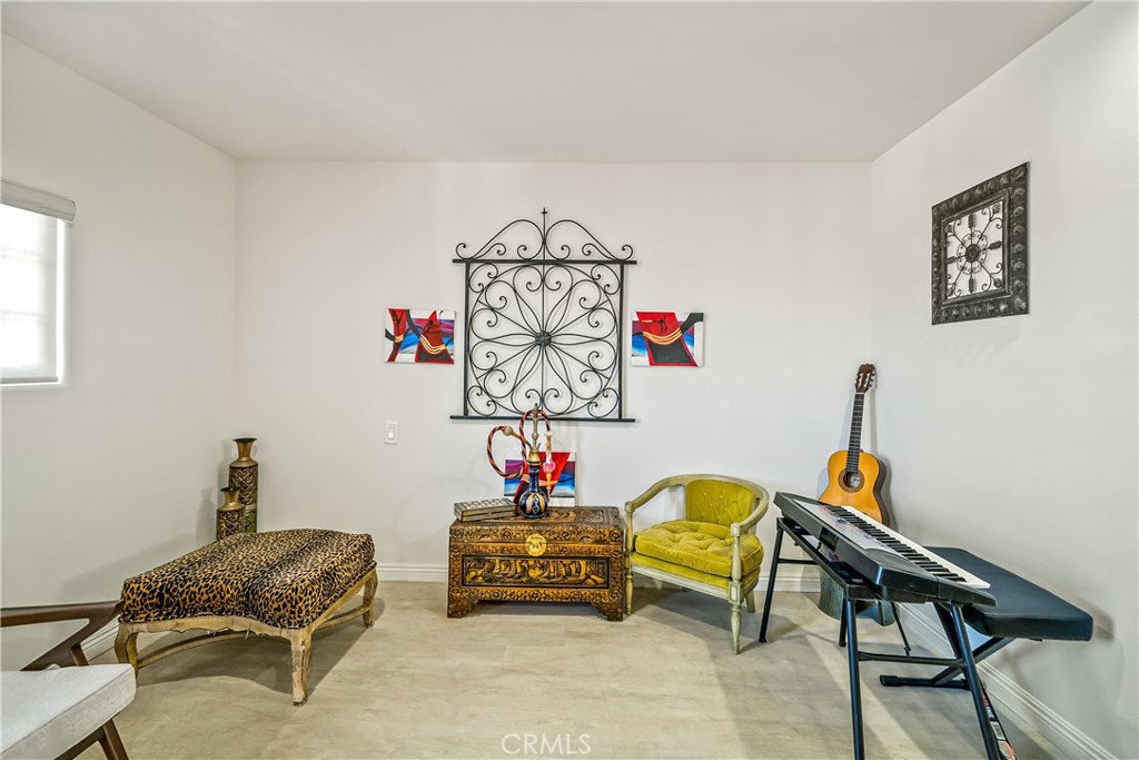 1101 North Maclay Avenue, Unit 1 San Fernando, CA 91340 - Photo 36 of 41 a living room with furniture and a chair