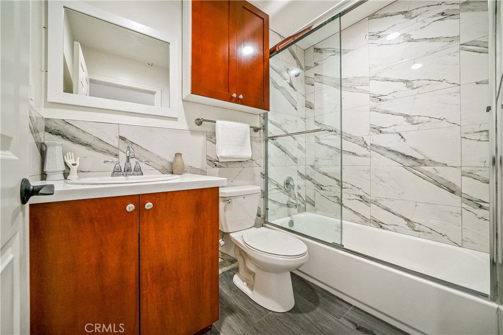 1101 North Maclay Avenue, Unit 1 San Fernando, CA 91340 - Photo 37 of 41 a bathroom with a sink a toilet and shower