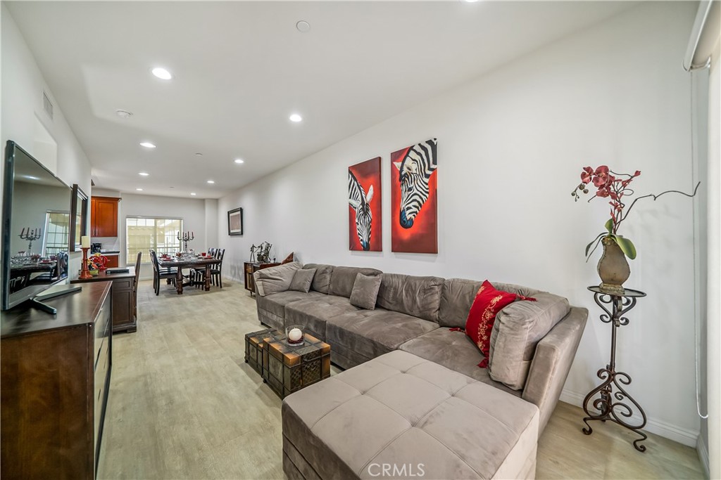 1101 North Maclay Avenue, Unit 1 San Fernando, CA 91340 - Photo 5 of 41 a living room with furniture and a flat screen tv