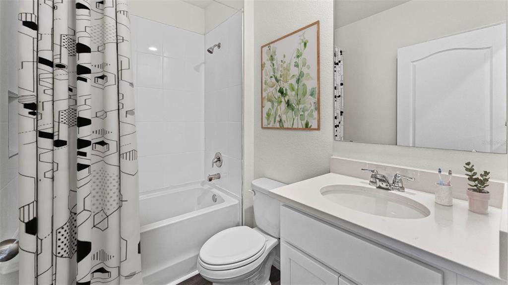 5233 Masser Road St. Cloud, FL 34772 - Photo 7 of 15 a bathroom with a sink toilet and shower