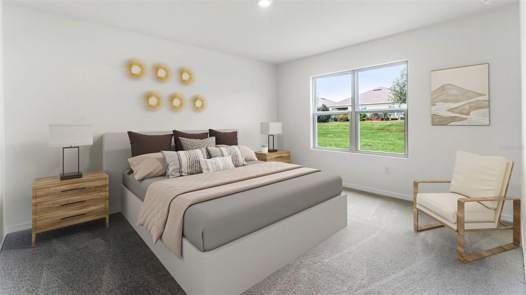 5233 Masser Road St. Cloud, FL 34772 - Photo 9 of 15 a bedroom with a bed and a chair