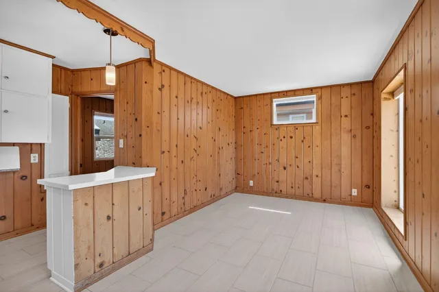 a view of a hallway with entryway door