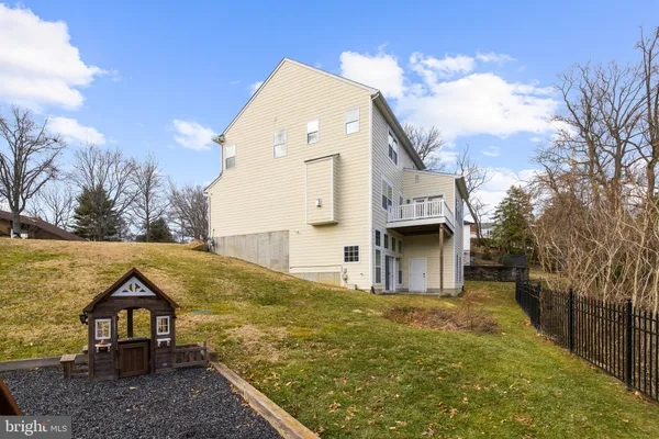 a view of house with yard and entertaining space