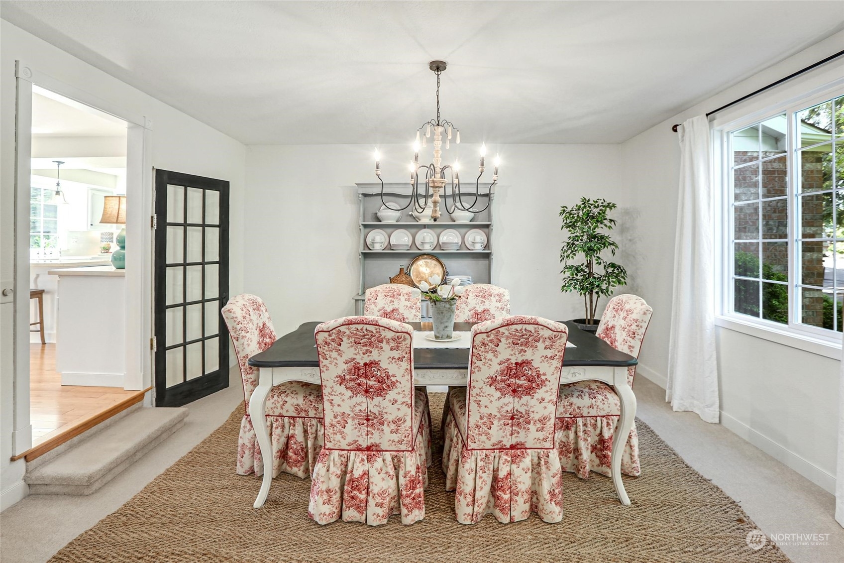 15629 Cascadian Way Bothell, WA 98012 - Photo 17 of 40 a view of a dining room with furniture and chandelier