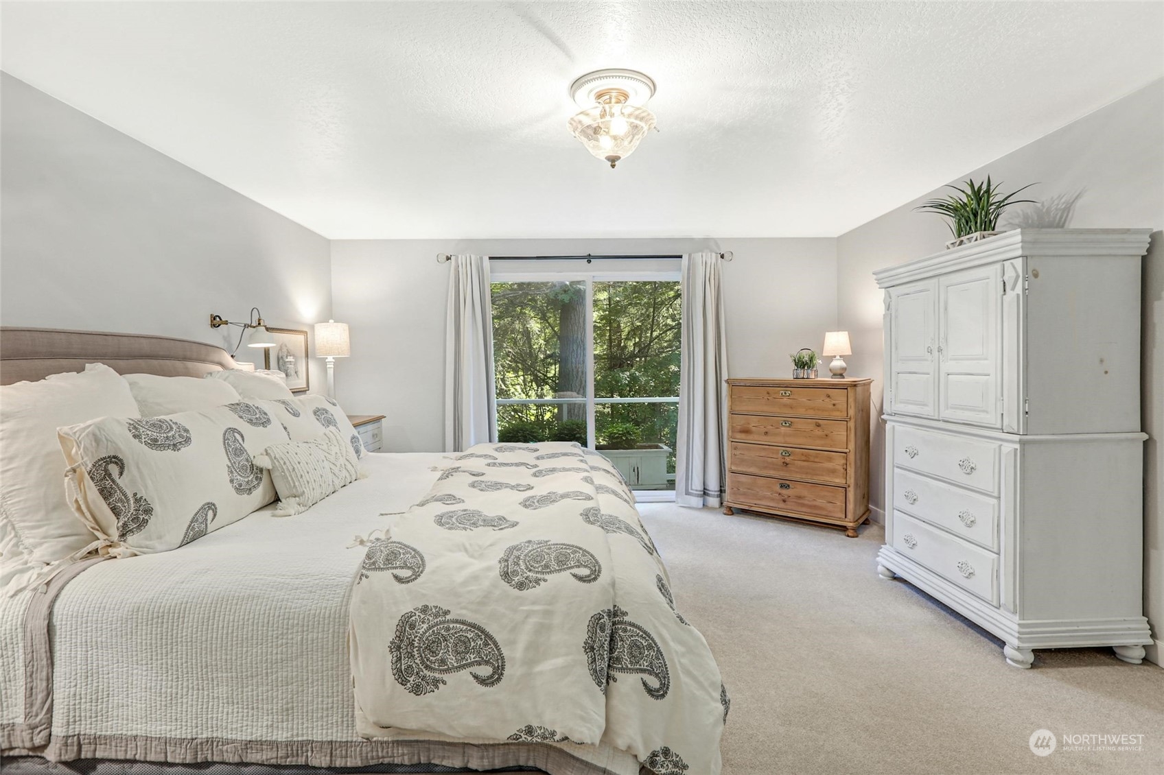 15629 Cascadian Way Bothell, WA 98012 - Photo 21 of 40 a bedroom with a bed and a window