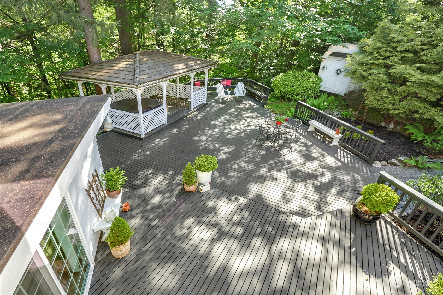 15629 Cascadian Way Bothell, WA 98012 - Photo 36 of 40 a roof deck with table and chairs and potted plants