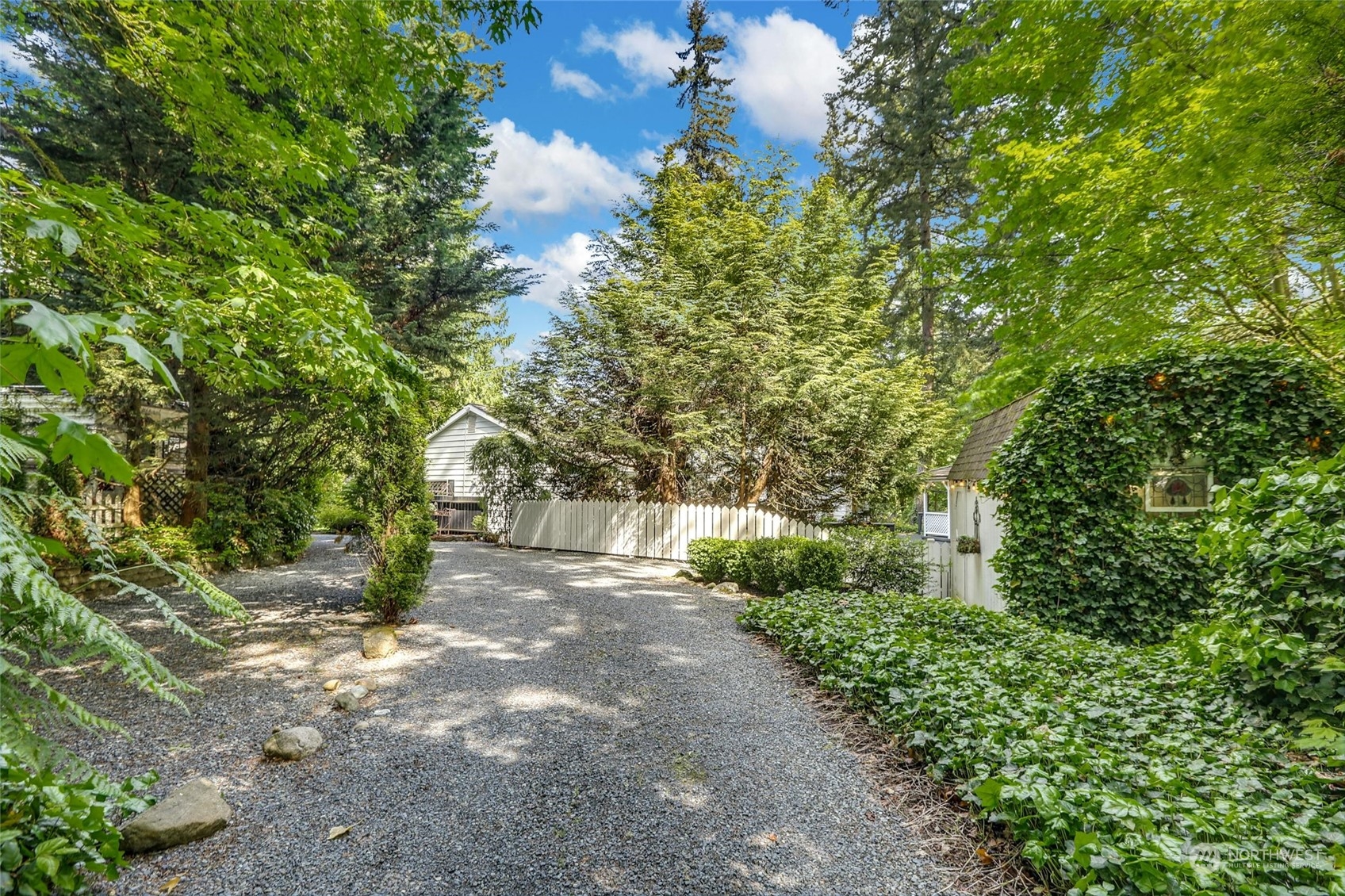15629 Cascadian Way Bothell, WA 98012 - Photo 38 of 40 a view of a yard with plants and trees