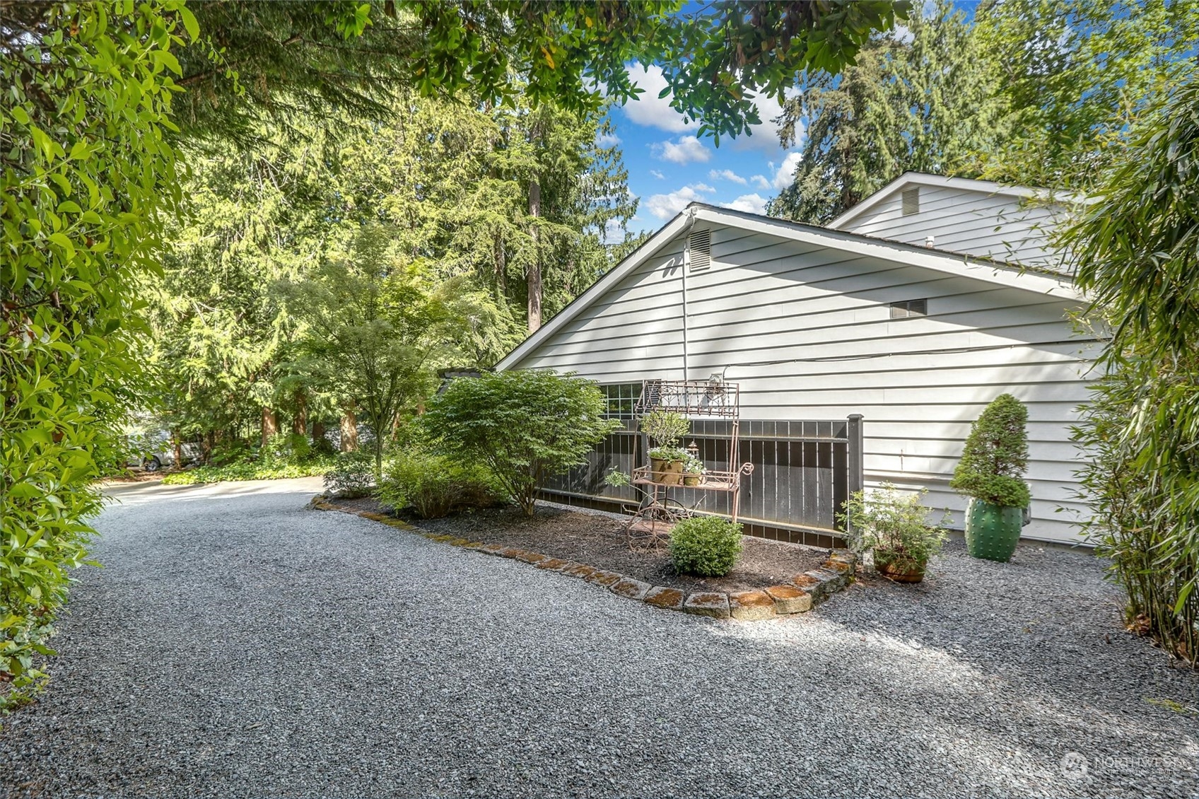 15629 Cascadian Way Bothell, WA 98012 - Photo 39 of 40 a view of a house with backyard and plants
