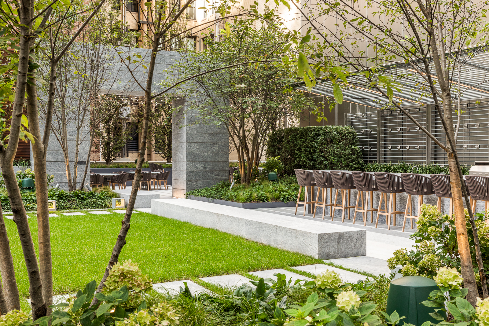 217 West 57th Street, Unit 121 Manhattan, NY 10019 - Photo 11 of 21 a garden view with a seating space