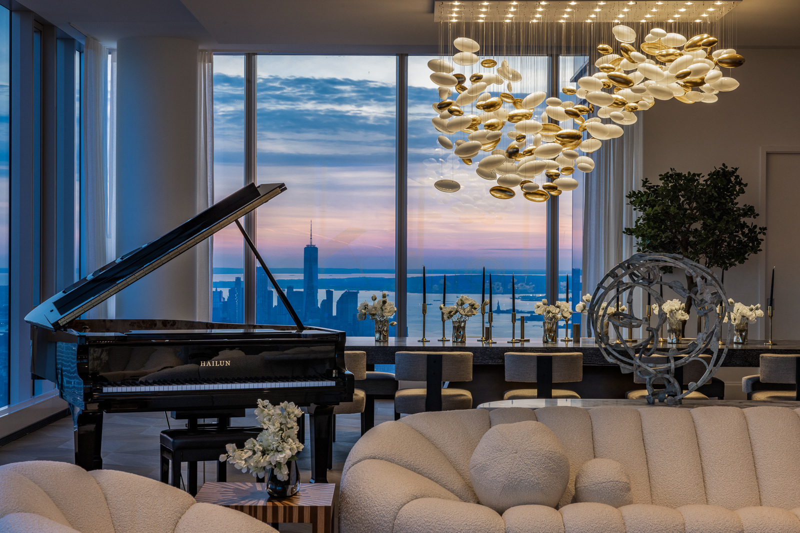 217 West 57th Street, Unit 121 Manhattan, NY 10019 - Photo 3 of 21 a living room filled with furniture and a potted plant