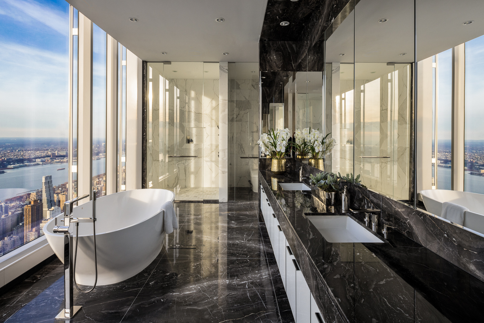 217 West 57th Street, Unit 121 Manhattan, NY 10019 - Photo 6 of 21 a large living room with large windows