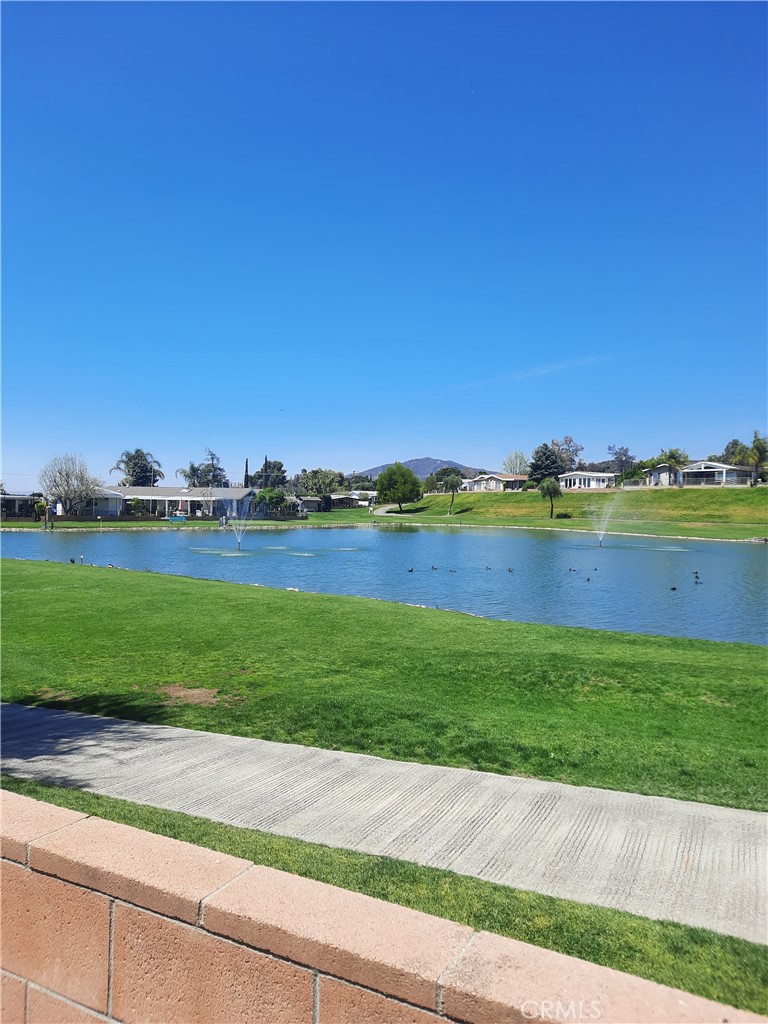 a view of a lake with a building in the background