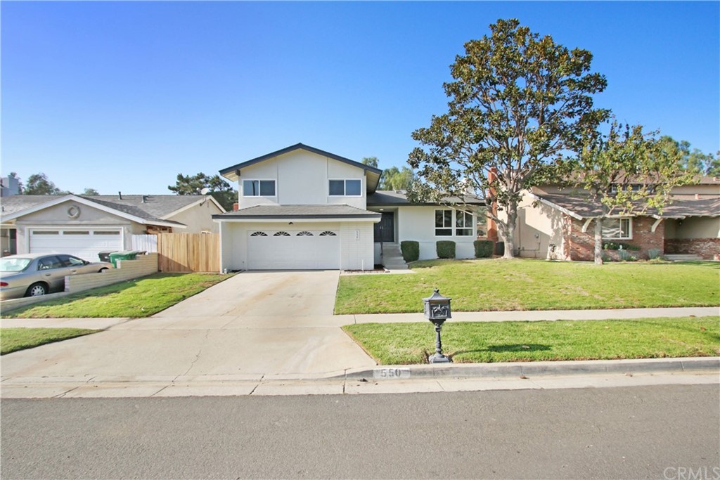 550 Termino Avenue Corona, CA 92879 - Photo 1 of 20 a front view of a house with a yard