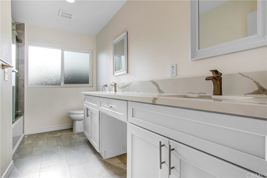 550 Termino Avenue Corona, CA 92879 - Photo 15 of 20 a bathroom with a sink and a toilet