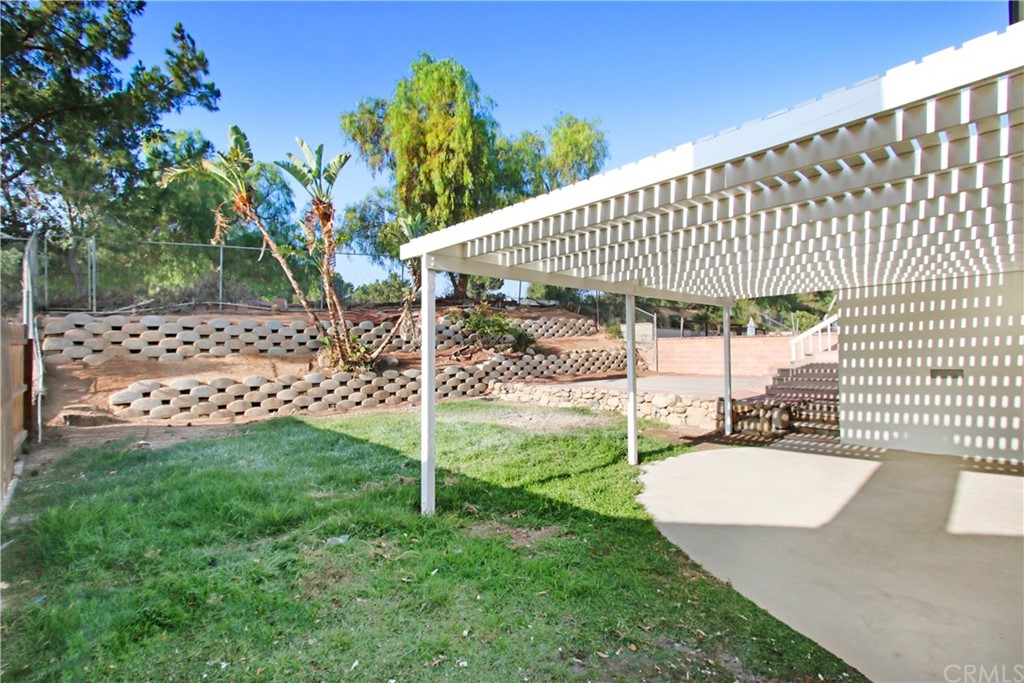 550 Termino Avenue Corona, CA 92879 - Photo 17 of 20 a view of a house with a backyard porch and sitting area