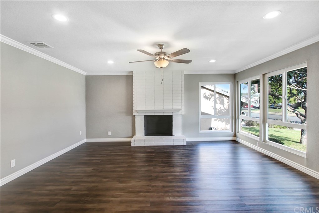 550 Termino Avenue Corona, CA 92879 - Photo 4 of 20 wooden floor fireplace and windows in an empty room