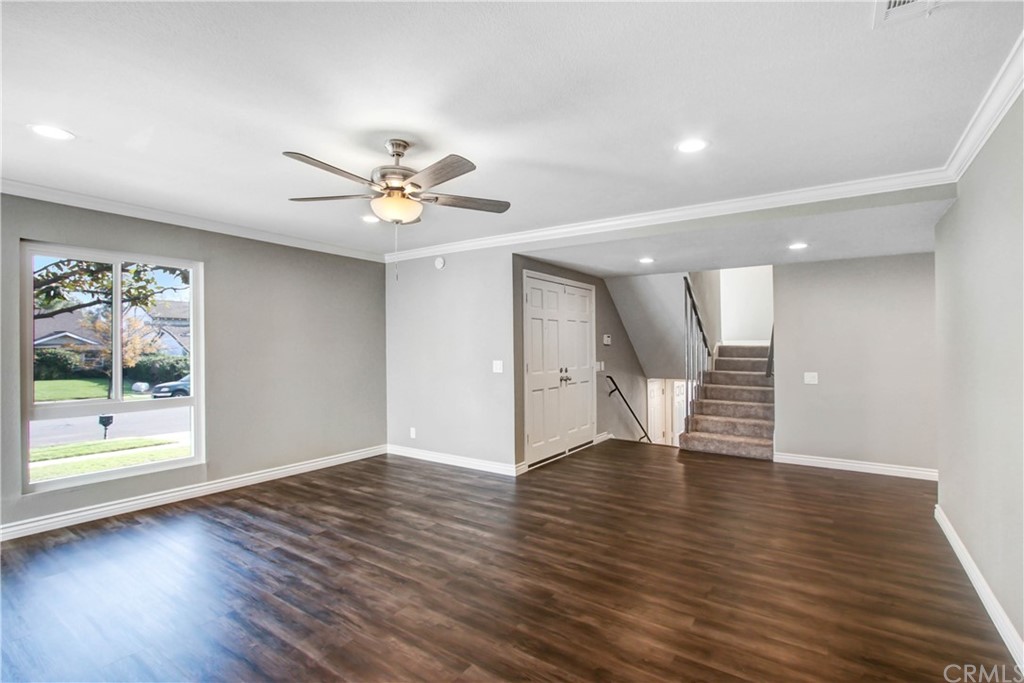 550 Termino Avenue Corona, CA 92879 - Photo 8 of 20 a view of an empty room with window and wooden floor