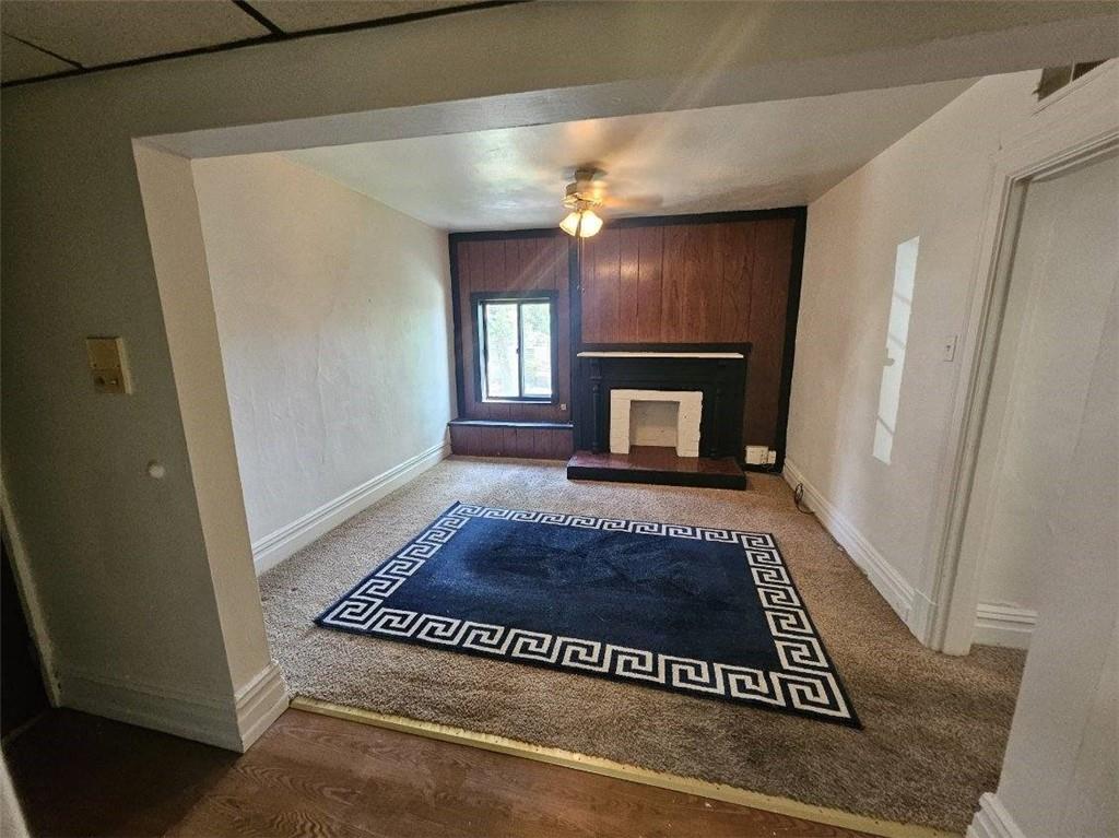 1907 Delaware Avenue, Unit 3 Pittsburgh, PA 15218 - Photo 2 of 9 a view of an empty room with window and fire place