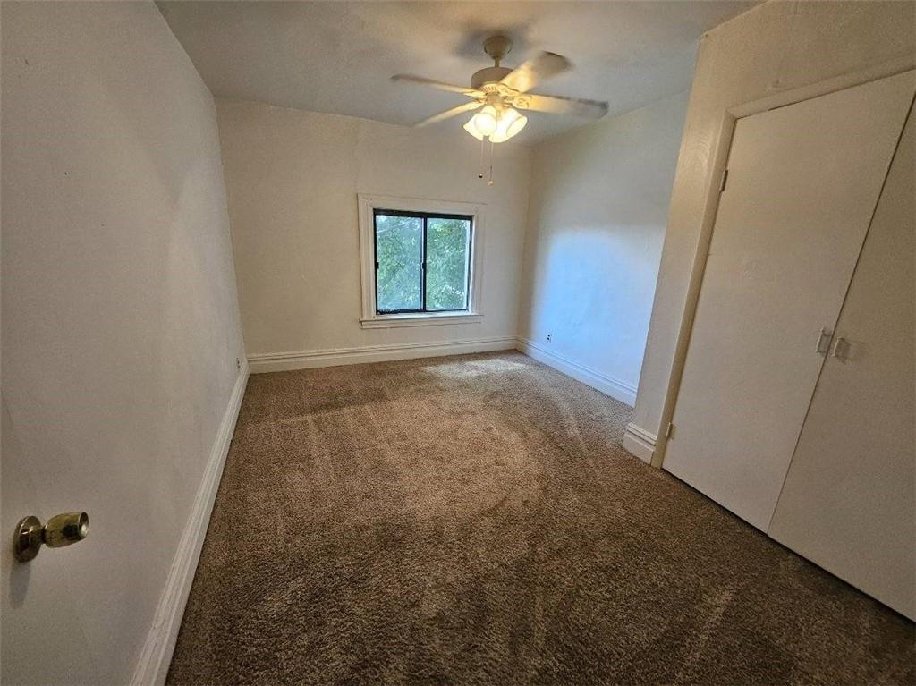 1907 Delaware Avenue, Unit 3 Pittsburgh, PA 15218 - Photo 3 of 9 wooden floor in an empty room with a window