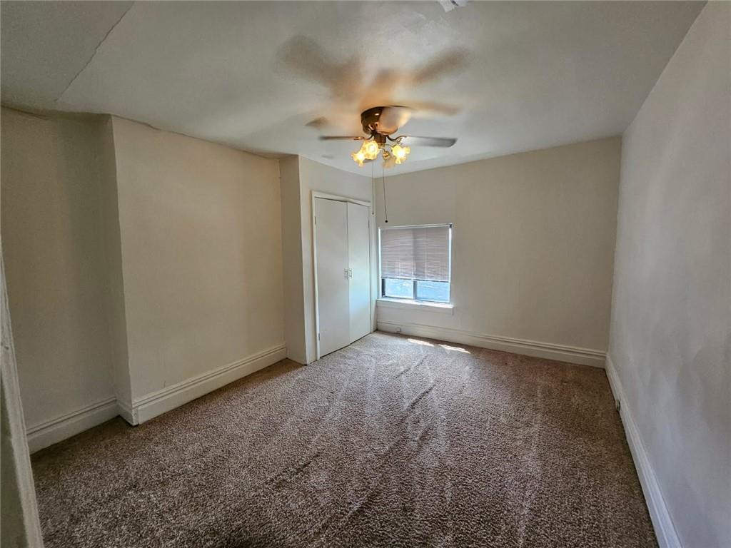 1907 Delaware Avenue, Unit 3 Pittsburgh, PA 15218 - Photo 4 of 9 wooden floor in an empty room with a window
