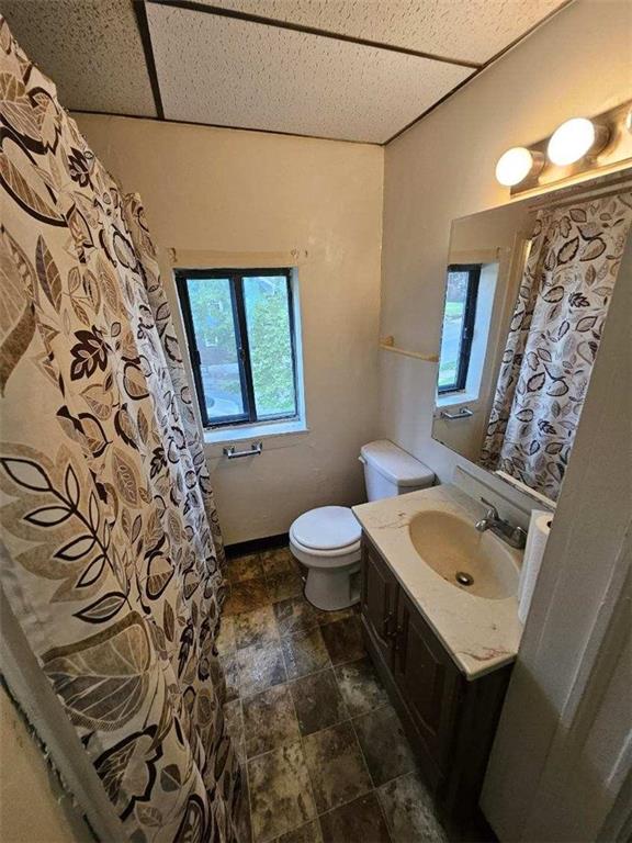 1907 Delaware Avenue, Unit 3 Pittsburgh, PA 15218 - Photo 8 of 9 a bathroom with a sink toilet and mirror