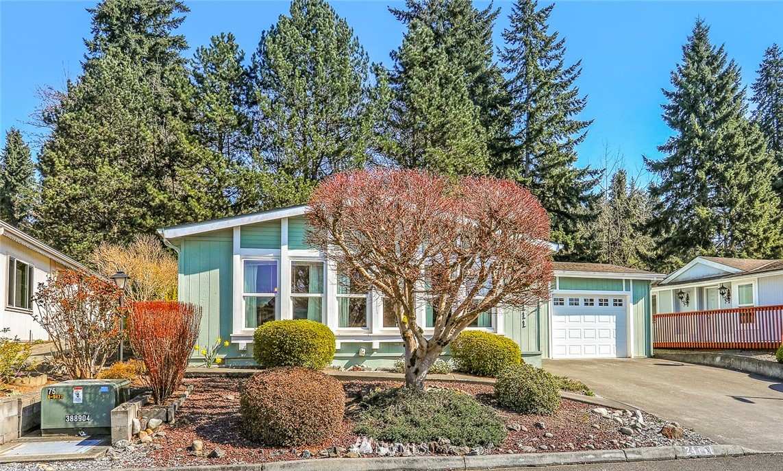 24111 8th Place West Bothell, WA 98021 - Photo 1 of 34 a front view of a house with garden