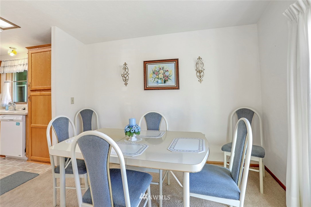 24111 8th Place West Bothell, WA 98021 - Photo 17 of 34 a view of a dining room with furniture and wooden floor