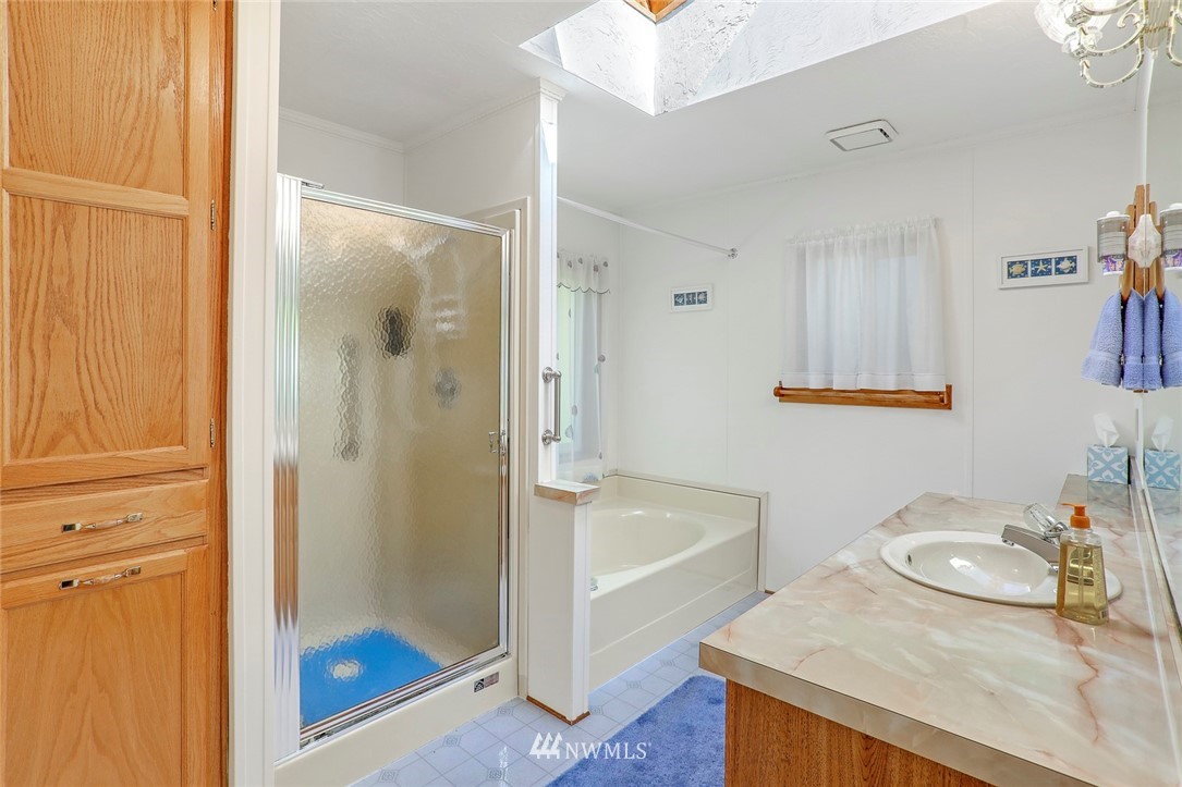 24111 8th Place West Bothell, WA 98021 - Photo 24 of 34 a bathroom with a granite countertop sink and a mirror