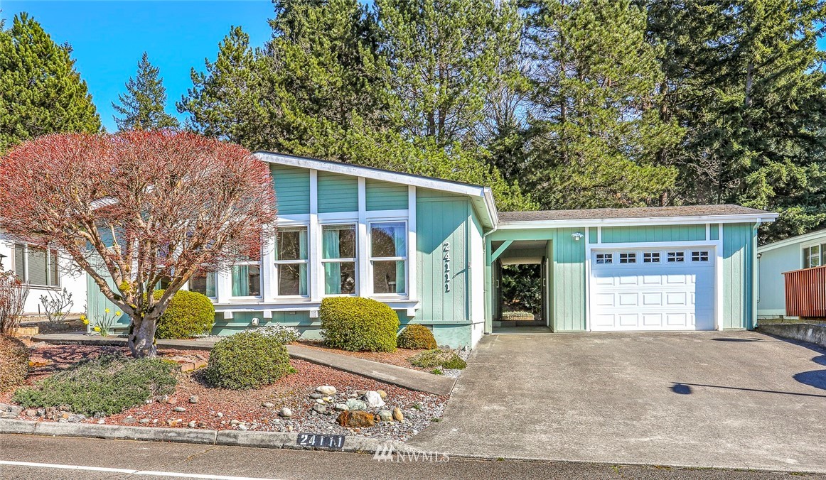 24111 8th Place West Bothell, WA 98021 - Photo 29 of 34 a front view of a house with a yard and garage