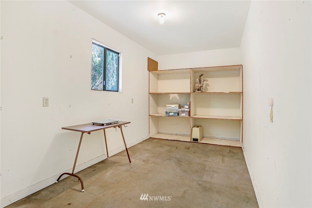 24111 8th Place West Bothell, WA 98021 - Photo 34 of 34 a room with a chair and white walls