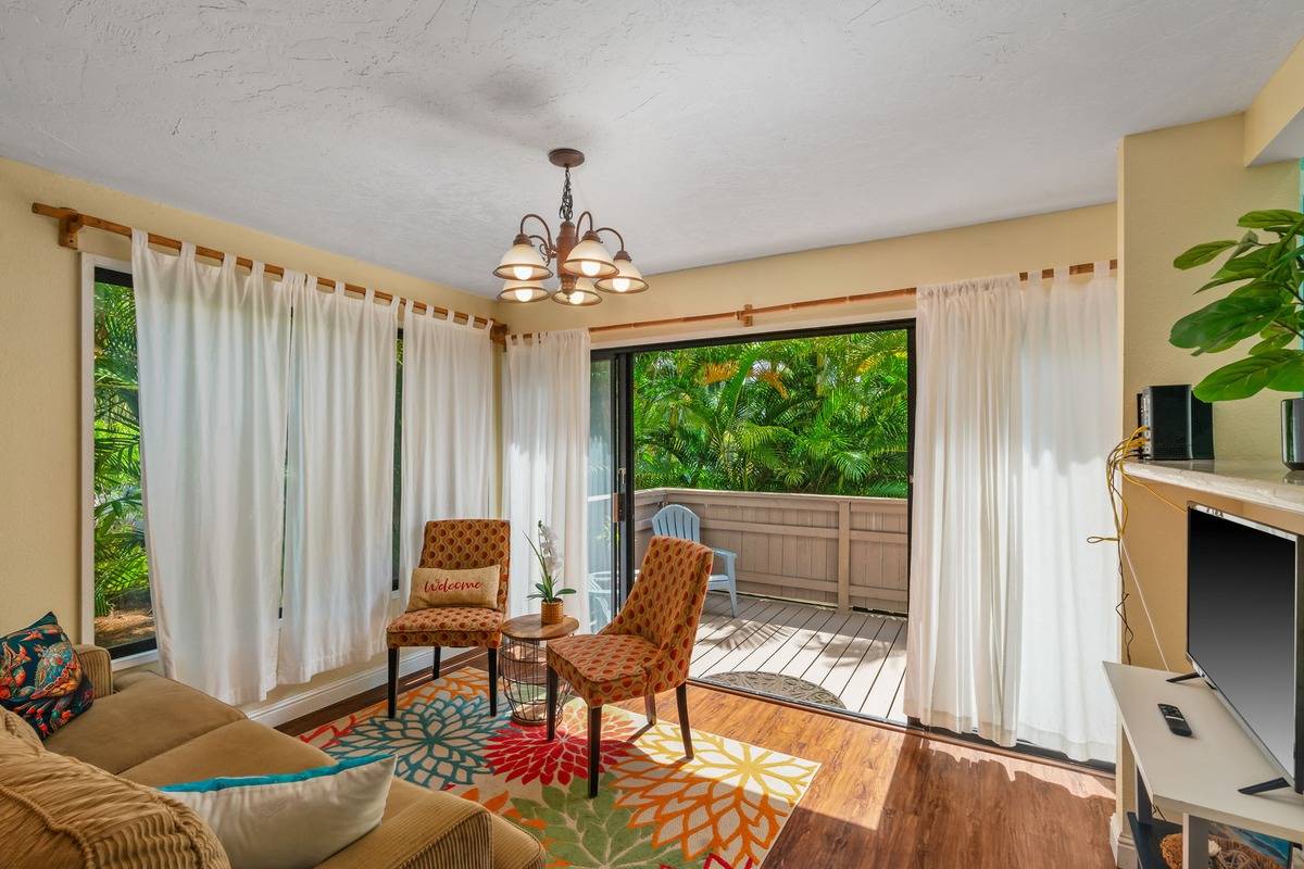 4480 Ka Haku Road, Unit 105 Princeville, HI 96722 - Photo 14 of 25 a living room with furniture and a window