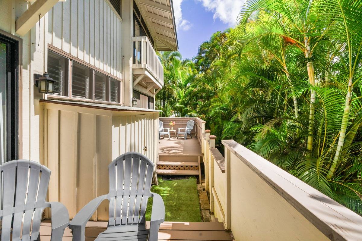 4480 Ka Haku Road, Unit 105 Princeville, HI 96722 - Photo 19 of 25 a balcony with table and chairs