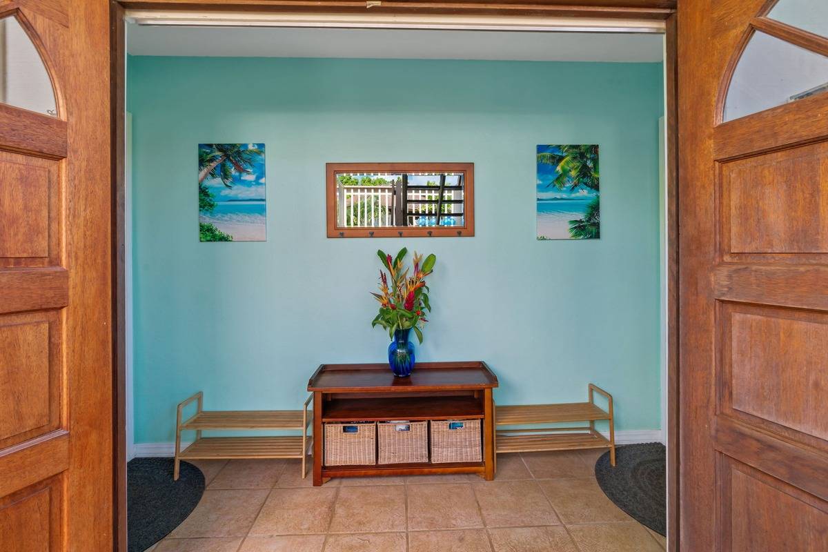 4480 Ka Haku Road, Unit 105 Princeville, HI 96722 - Photo 22 of 25 a house view with a bench and a potted plant