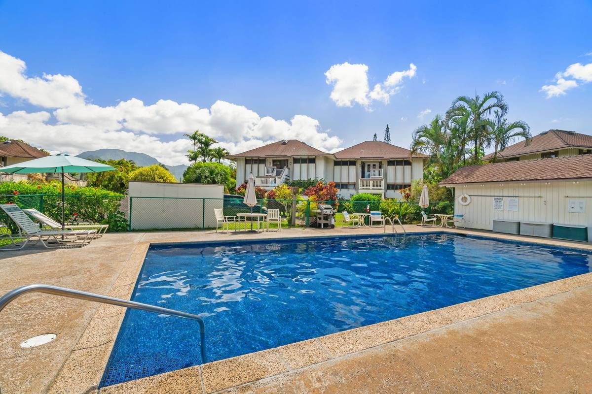 4480 Ka Haku Road, Unit 105 Princeville, HI 96722 - Photo 23 of 25 a front view of a house with garden