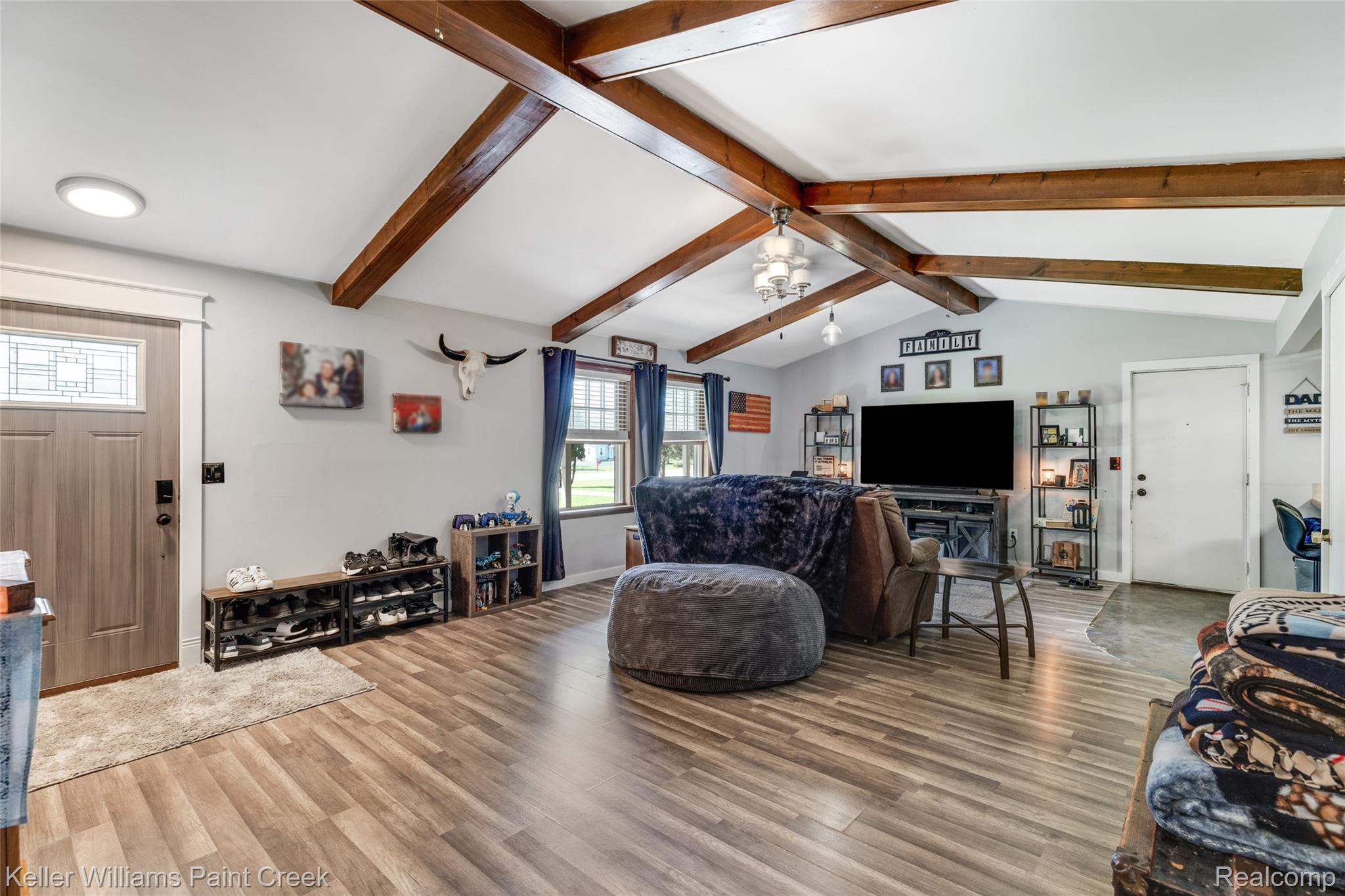 6459 East Potter Road Davison, MI 48423 - Photo 3 of 22 Vaulted ceiling with exposed wood beams