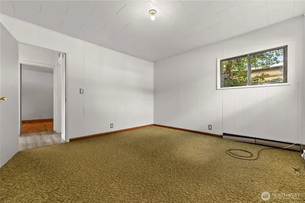 a bathroom with a sink mirror vanity and toilet