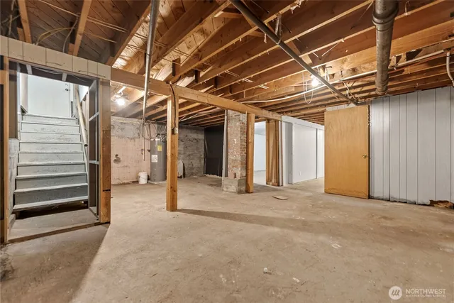 a view of a house with a yard and potted plants