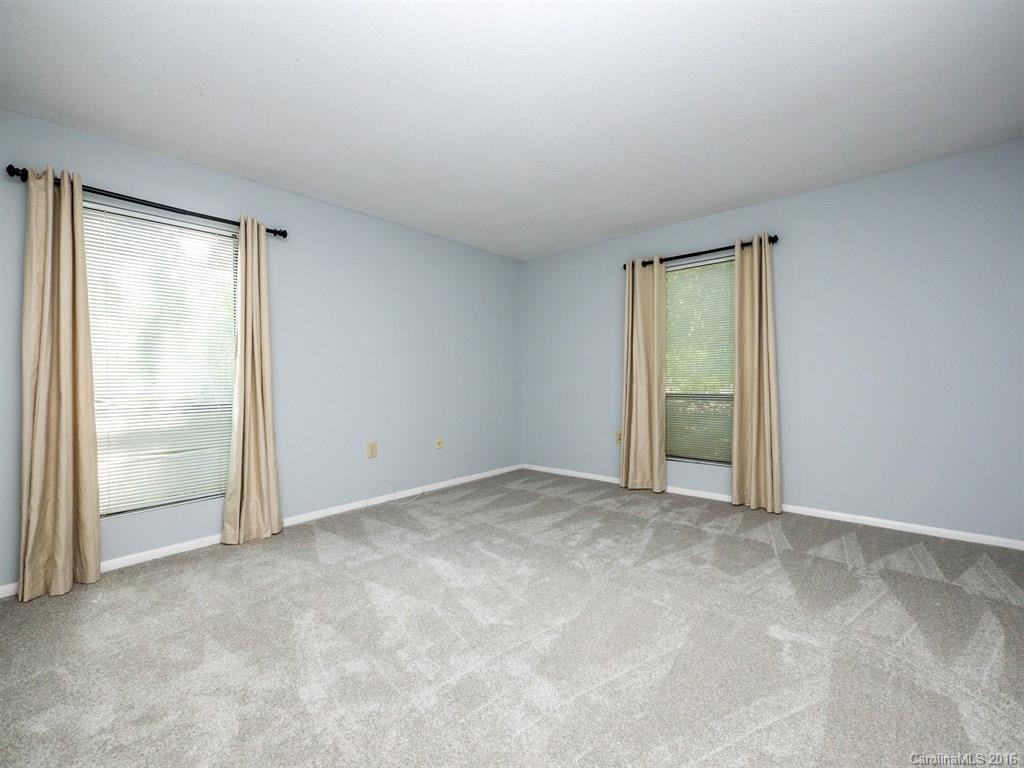 4918 Sardis Road, Unit A Charlotte, NC 28270 - Photo 14 of 19 an empty room with sliding glass door