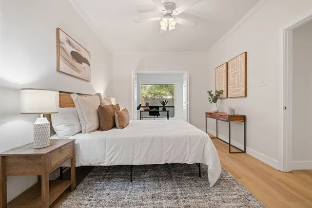 a bedroom with a bed and a lamp on table