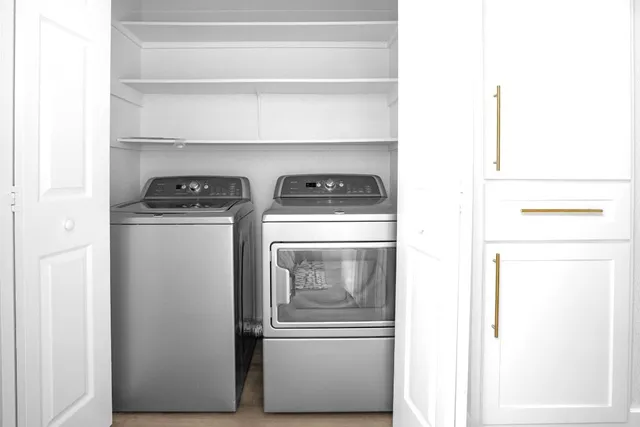 a view of a chairs and table in the balcony