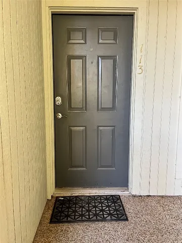 a view of a car parked in front of a building