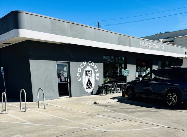a view of a car parked in front of a building